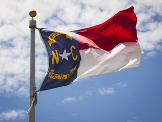 Image of North Carolina flag via Shutterstock