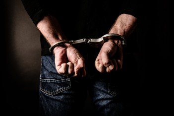 handcuffed via: Annotee shutterstock