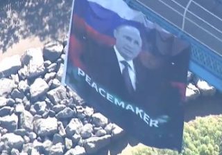 putin-flag via CBS2