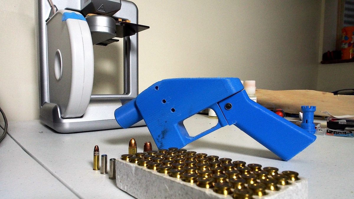 A Liberator pistol appears on July 11, 2013 next to the 3D printer on which its components were made. The single-shot handgun is the first firearm that can be made entirely with plastic components forged with a 3D printer and computer-aided design (CAD) files downloaded from the Internet.