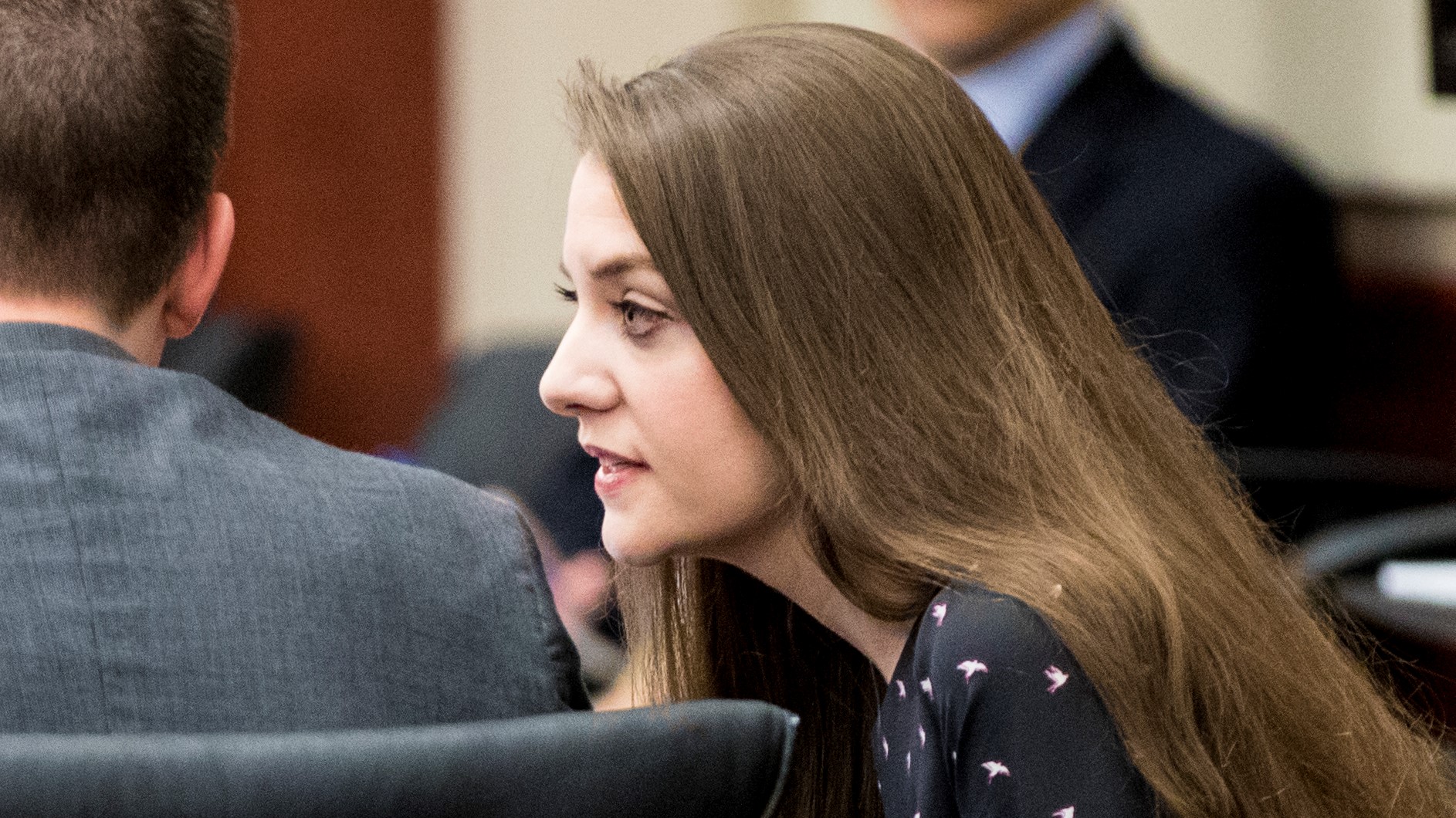 Shayna Hubers, 27, talks to Zachary Walden, one of her attorneys, at the beginning of the third day of testimony Thursday, August 16, 2018 at the Campbell County Courthouse in Newport, Ky. Hubers was originally convicted of shooting Ryan Poston six times in his Highland Heights condo on October 12, 2012 and sentenced to 40 years in prison. She was granted a retrial after her attorney discovered a juror in the first trial had a prior felony conviction. The juror's 1992 unpaid child support conviction disqualified him from jury duty under Kentucky law. Campbell County Judge Daniel Zalla is the presiding judge.