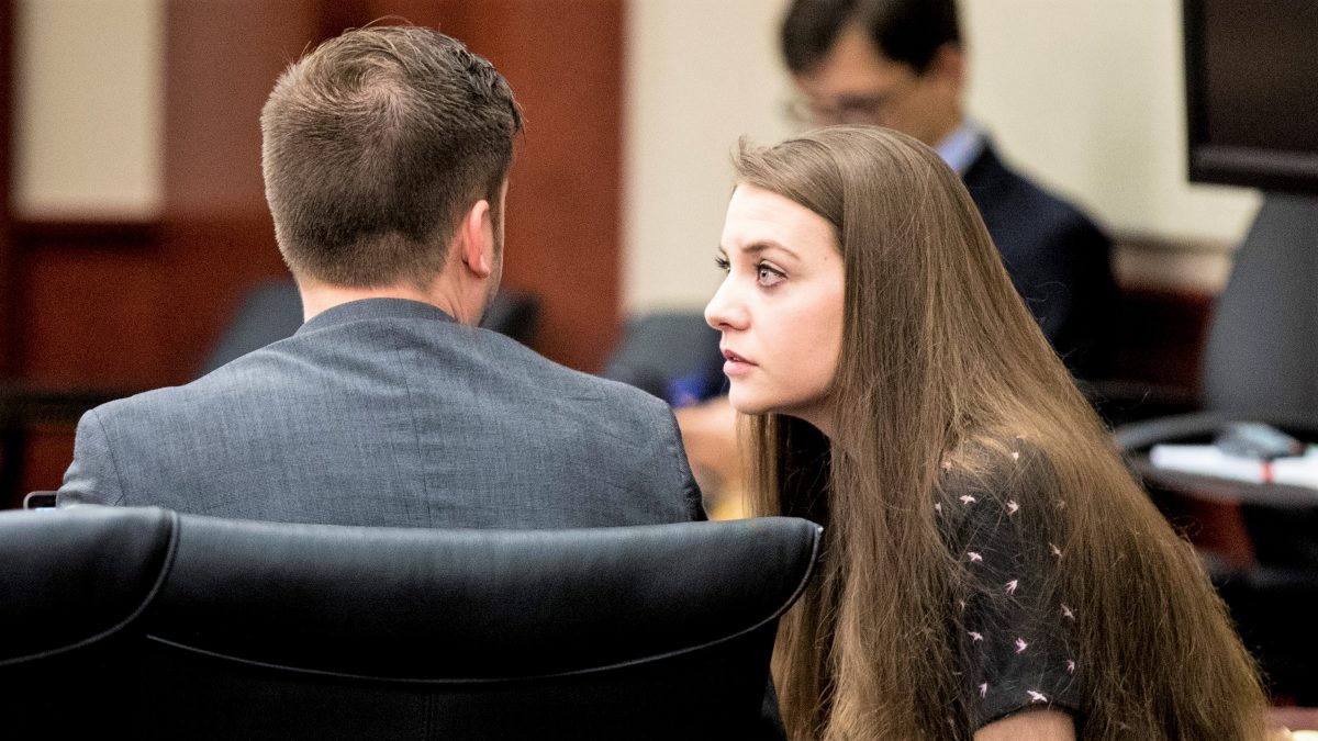 Shayna Hubers, 27, talks to Zachary Walden, one of her attorneys, at the beginning of the third day of testimony Thursday, August 16, 2018 at the Campbell County Courthouse in Newport, Ky. Hubers was originally convicted of shooting Ryan Poston six times in his Highland Heights condo on October 12, 2012 and sentenced to 40 years in prison. She was granted a retrial after her attorney discovered a juror in the first trial had a prior felony conviction. The juror's 1992 unpaid child support conviction disqualified him from jury duty under Kentucky law. Campbell County Judge Daniel Zalla is the presiding judge.