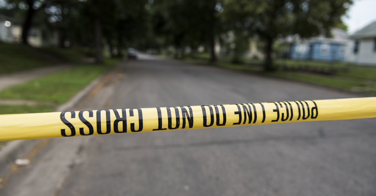 MINNEAPOLIS, MN - JUNE 24: A piece of police tape is strung across North Camden Street on June 24, 2018 in Minneapolis, Minnesota. Thurman Blevins was shot and killed yesterday after an altercation with Minneapolis Police.