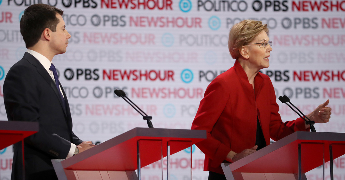 LOS ANGELES, CALIFORNIA - DECEMBER 19: Sen. Elizabeth Warren (D-MA) speaks as South Bend, Indiana Mayor Pete Buttigieg listens during the Democratic presidential primary debate at Loyola Marymount University on December 19, 2019 in Los Angeles, California. Seven candidates out of the crowded field qualified for the 6th and last Democratic presidential primary debate of 2019 hosted by PBS NewsHour and Politico. (Photo by Justin Sullivan/Getty Images)