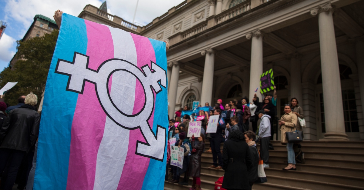 NEW YORK, NY - OCTOBER 24: L.G.B.T. activists and their supporters rally in support of transgender people on the steps of New York City Hall, October 24, 2018 in New York City. The group gathered to speak out against the Trump administration's stance toward transgender people. Last week, The New York Times reported on an unreleased administration memo that proposes a strict biological definition of gender based on a person's genitalia at birth.