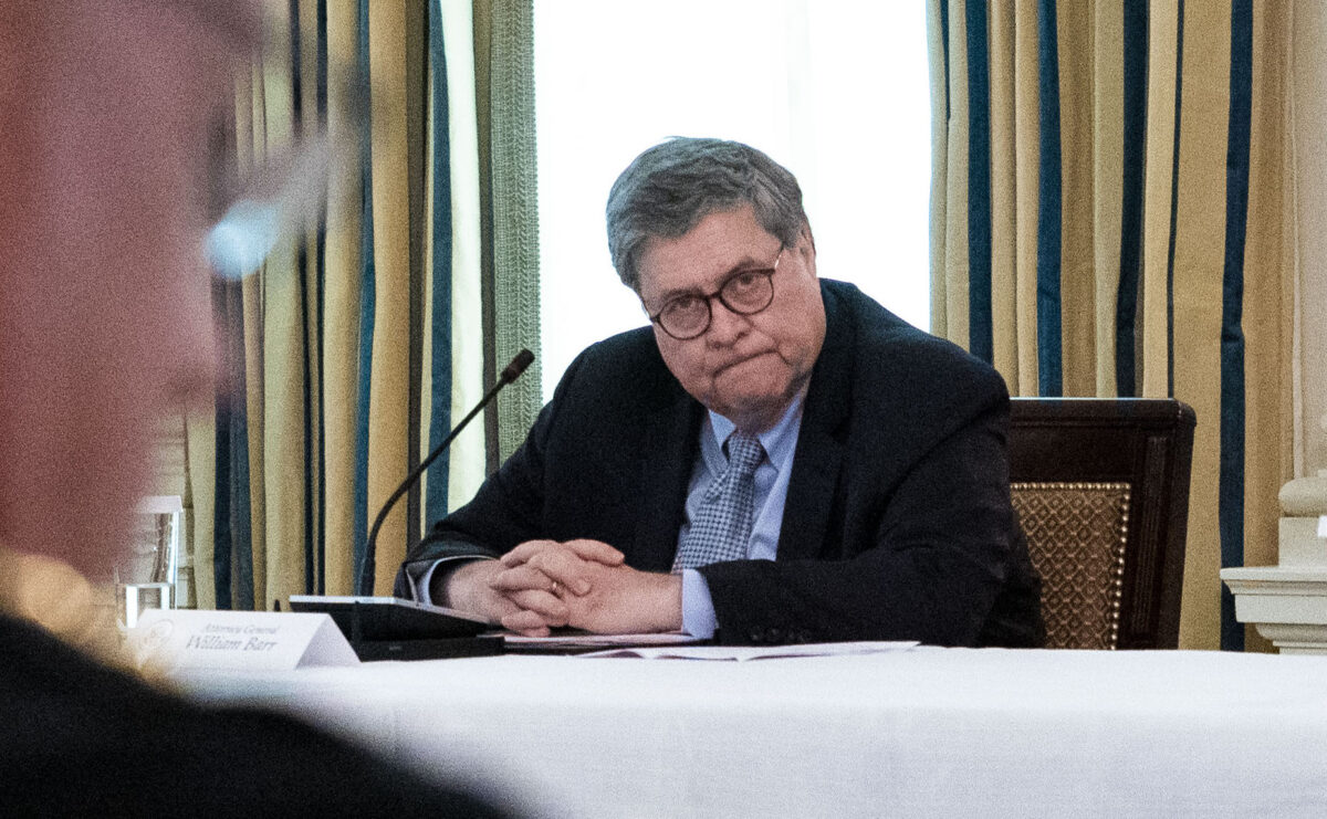WASHINGTON, DC - JUNE 08: Attorney General William Barr looks on as U.S. President Donald Trump makes remarks as he participates in a roundtable with law enforcement officials in the State Dining Room of the White House, June, 8, 2020 in Washington, DC.