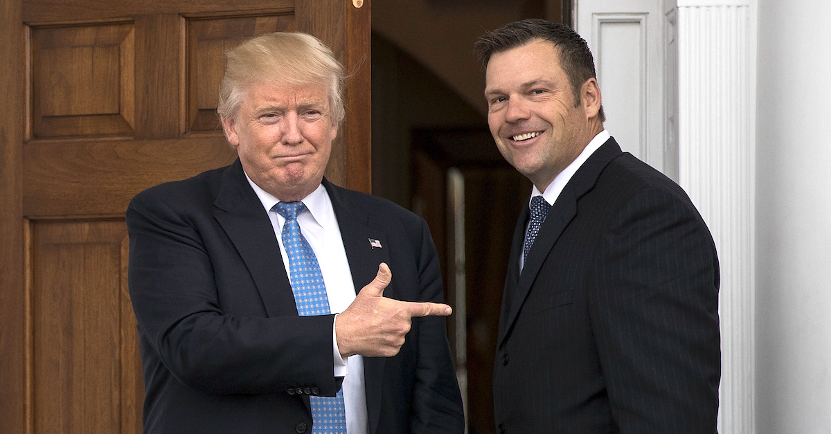 BEDMINSTER TOWNSHIP, NJ - NOVEMBER 20: (L to R) President-elect Donald Trump and Kris Kobach, Kansas secretary of state, pose for a photo following their meeting with president-elect at Trump International Golf Club, November 20, 2016 in Bedminster Township, New Jersey. Trump and his transition team are in the process of filling cabinet and other high level positions for the new administration.