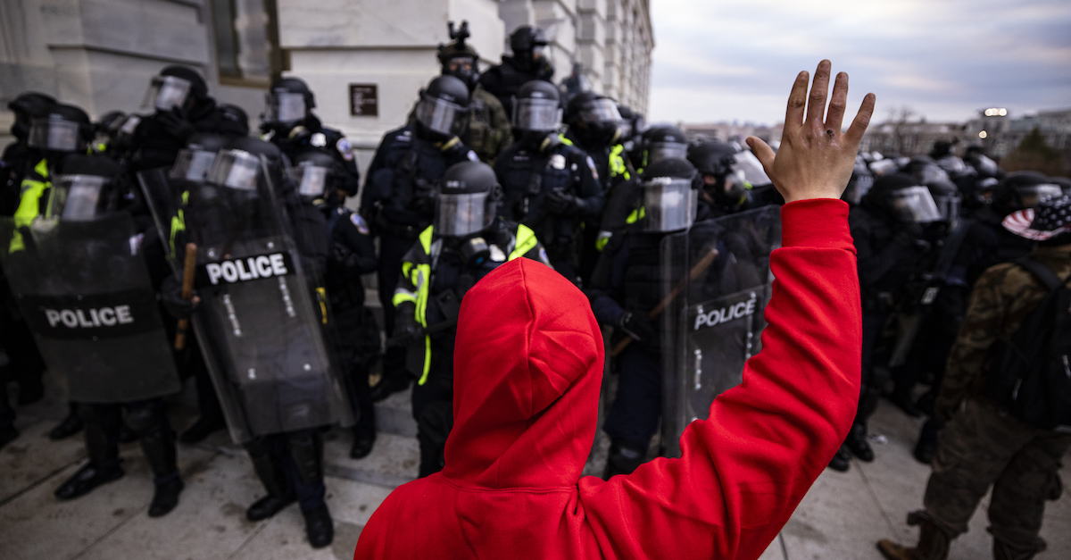 WASHINGTON, DC - JANUARY 06: Police officers attempt to push back pro-Trump supporters that are trying to storm the US Capitol following a rally with President Donald Trump on January 6, 2021 in Washington, DC. Trump supporters gathered in the nation's capital today to protest the ratification of President-elect Joe Biden's Electoral College victory over President Trump in the 2020 election. 