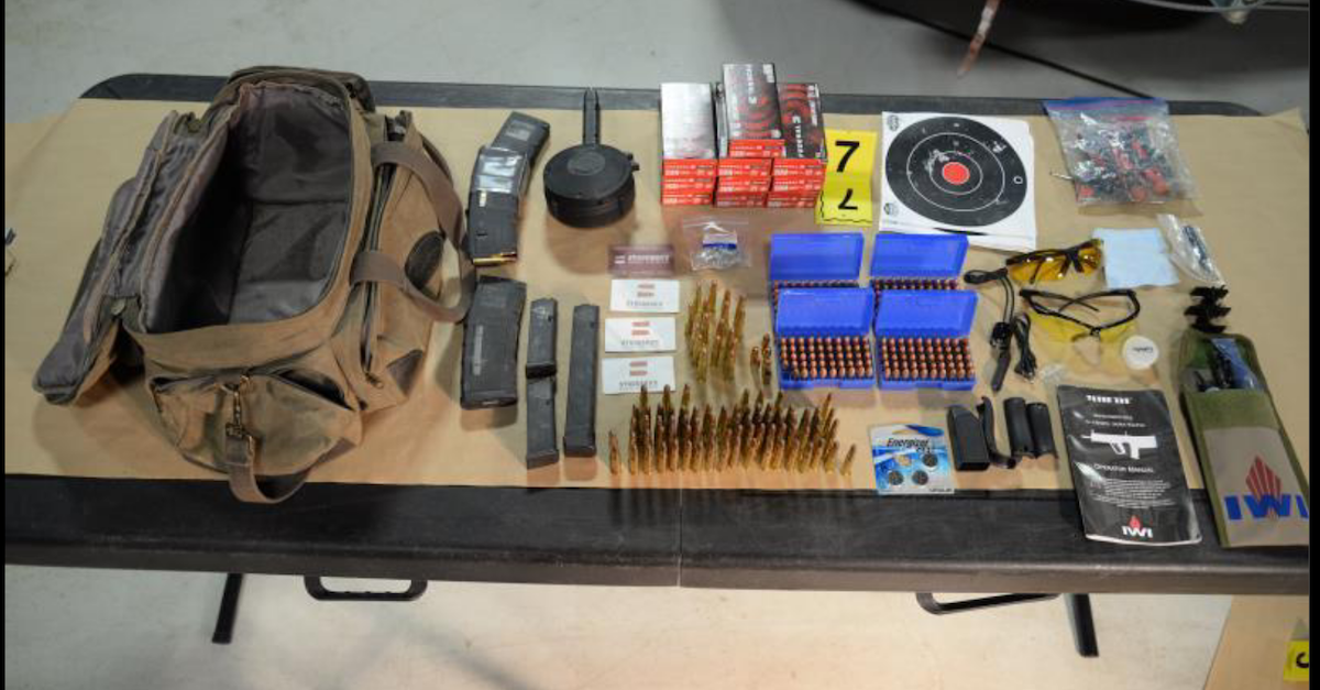 Guns and ammunition obtained by the FBI on a table