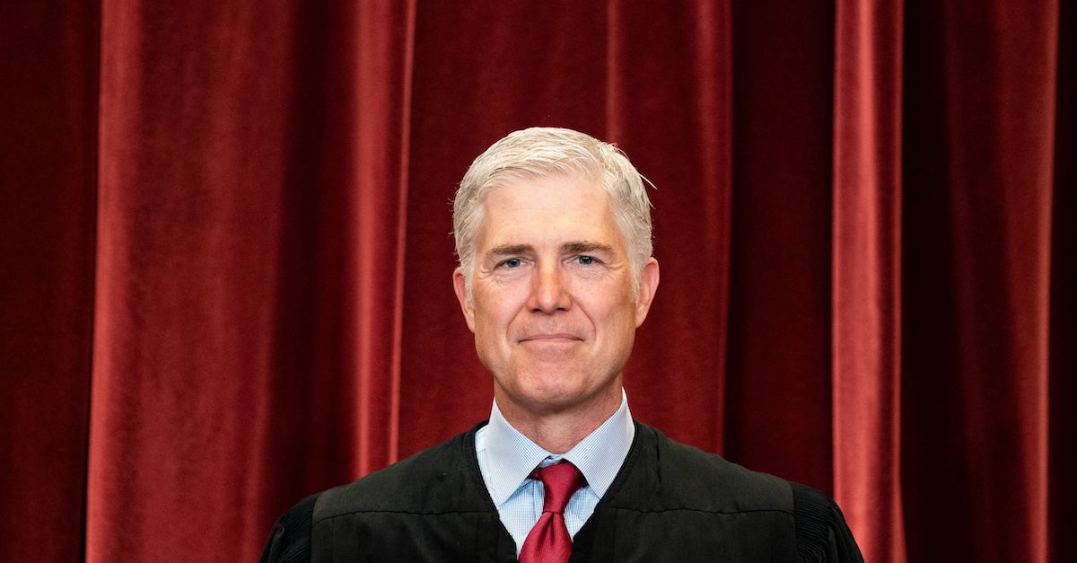 Associate Justice Neil Gorsuch stands in a group photo of the Justices at the Supreme Court in Washington, DC on April 23, 2021.