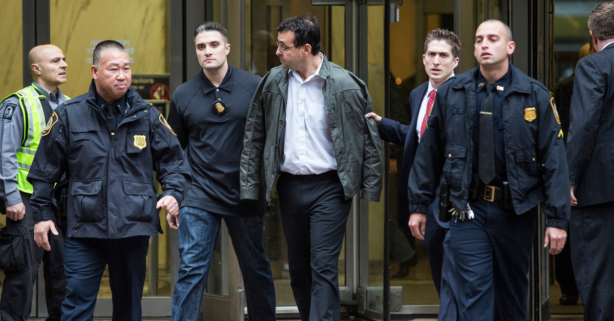 NEW YORK, NY - DECEMBER 17: Attorney Evan Greebel (C), is brought out of 26 Federal Plaza by law enforcement officials after being arrested as a co-defendent with Turing Pharmaceutical CEO Martin Shkreli for securities fraud on December 17, 2015 in New York City. Shkreli gained notoriety earlier this year for raising the price of Daraprim, a medicine used to treat the parasitic condition of toxoplasmosis, from $13.50 to $750 though the arrest that happened early this morning does not involve that price hike. (Photo by Andrew Burton/Getty Images)