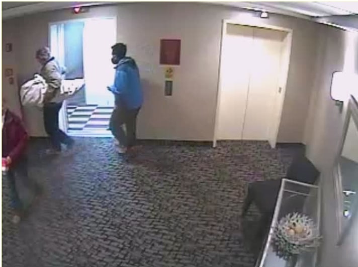 Still of Thomas Caldwell on hotel surveillance