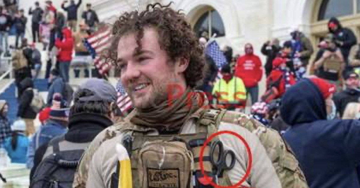 Robert Morss appears in tactical camouflage in front of the U.S. Capitol