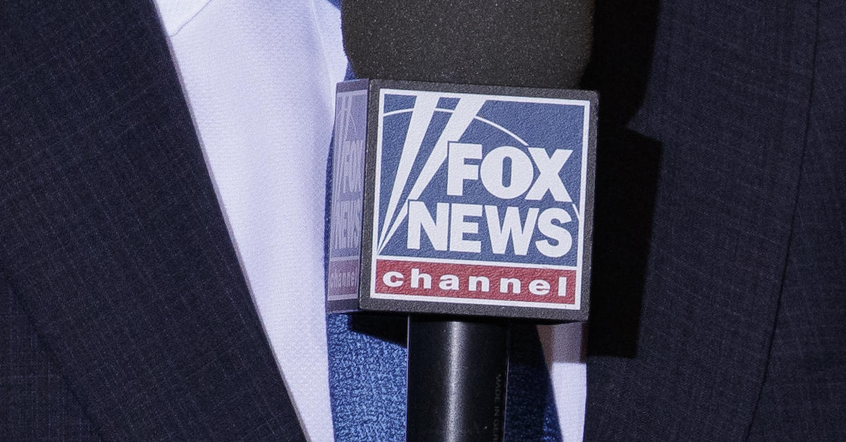 A Fox News correspondent holds a Fox News microphone in a September 25, 2019 file photo.