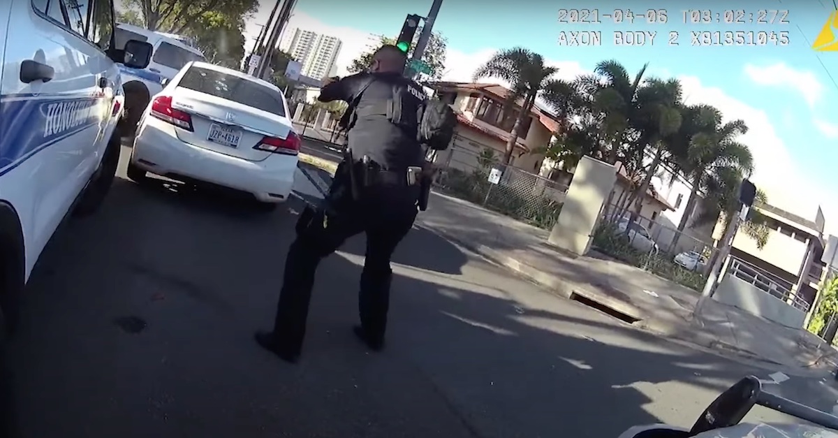 Body camera footage shows three Hawaii police officers opening fire on a vehicle after a police chase. One occupant was injured; the other, the driver, died.