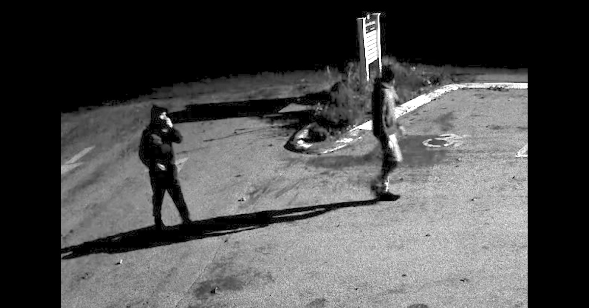 A freeze frame from a security camera shows two burglars approaching the Willington, Conn. Town Hall on Saturday, Oct. 23, 2021.
