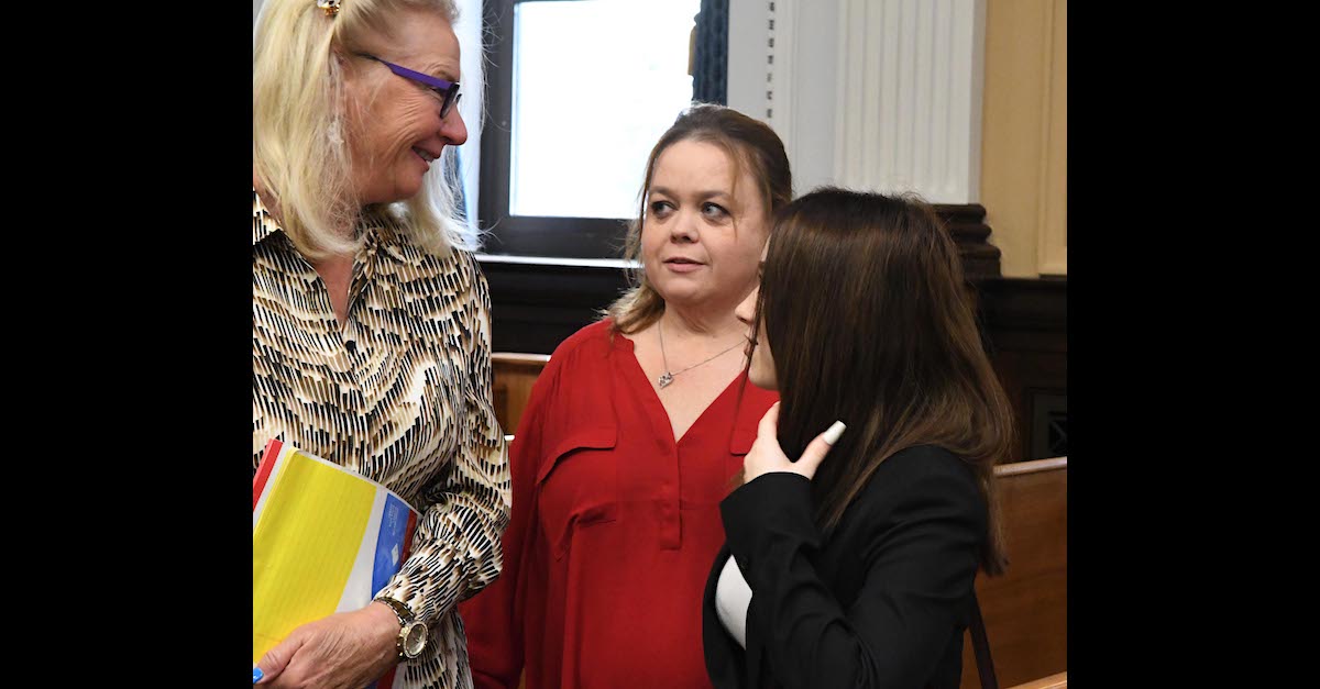 Defense jury expert Jo-Ellan Dimitrius (left) speaks to Kyle Rittenhouse's mother Wendy Rittenhouse (center) and sister McKenzie Rittenhouse (right) during a break in the trial of Kyle Rittenhouse in Kenosha, Wisconsin, Thurs., Nov. 4, 2021.