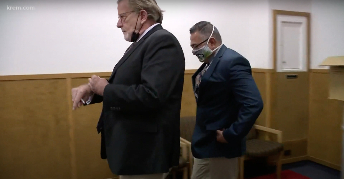 Defense attorney John Henry Browne (left) and Richard Aguirre (right) are seen in a KREM-TV screengrab leaving court after a judge declared a mistrial.