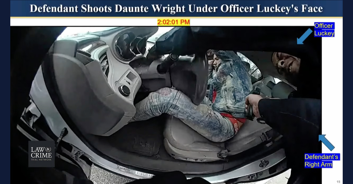 A still frame from Kimberly Potter's body-worn camera shows the instant she shot Daunte Wright. (Image via a slide used during prosecution opening statements.)