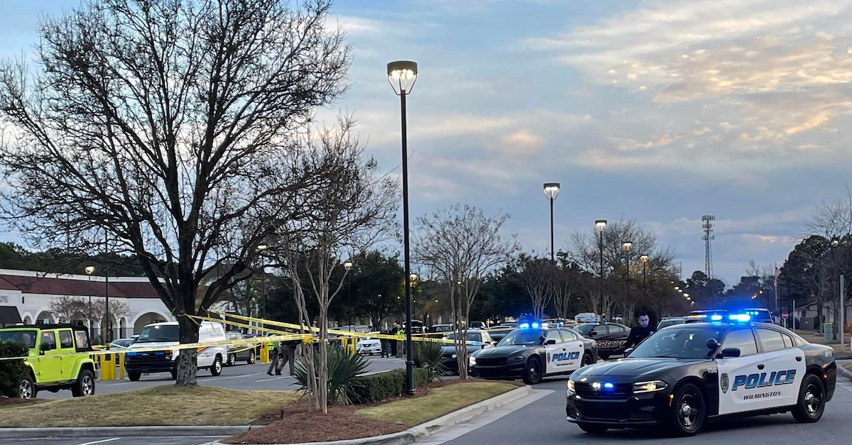 The scene outside of the Landfall Shopping Center in Wilmington, N.C. where Wilbert Lamont Robinson allegedly gunned down three members of his family