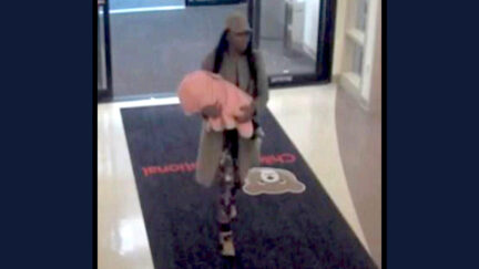Tyra Monae Anderson appears carrying her nonresponsive baby into a hospital in a security camera image embedded within Washington, D.C. Superior Court documents.