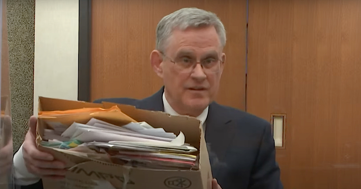 Defense attorney Paul Engh showed the court one of three alleged boxes of letters of support that Kim Potter received while in jail. (Image via the Law&Crime Network.)
