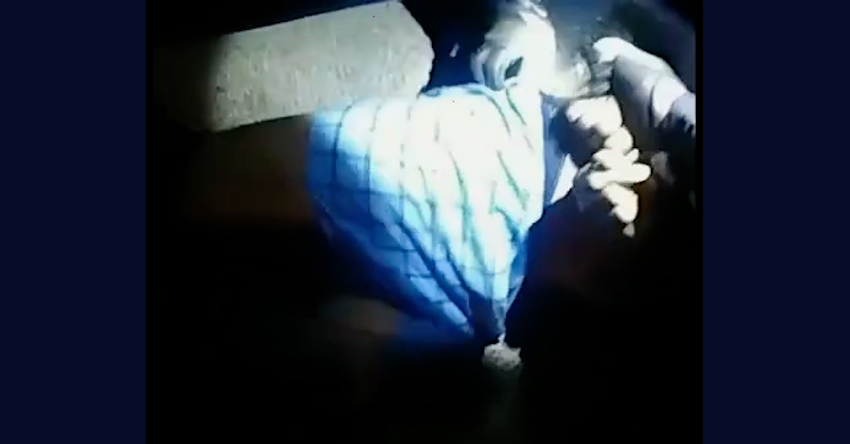 Body camera footage showed the hands of Indianapolis police officers near the blue windowpane-patterned boxer shorts of Paul Johnson. This screengrab was taken after Johnson was already on the ground and after Officer Travis Lewis allegedly grabbed Johnson's genitals.