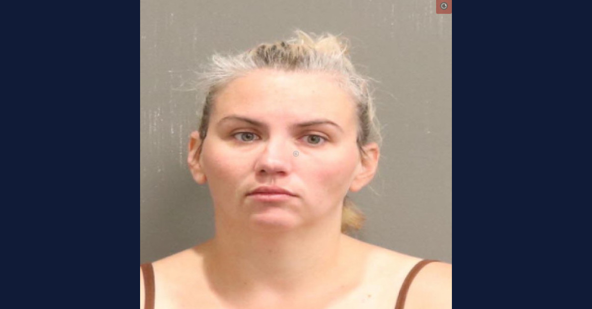 Amy Manning appears in a booking photo