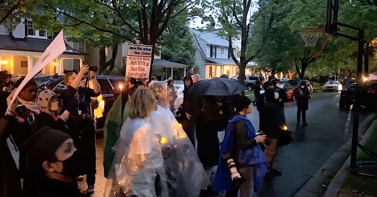 Abortion rights advocates stage a protest outside the home of U.S. Associate Supreme Court Justice Brett Kavanaugh on May 11, 2022 in Chevy Chase, Maryland. (Photo by Twitter video screengrab.)