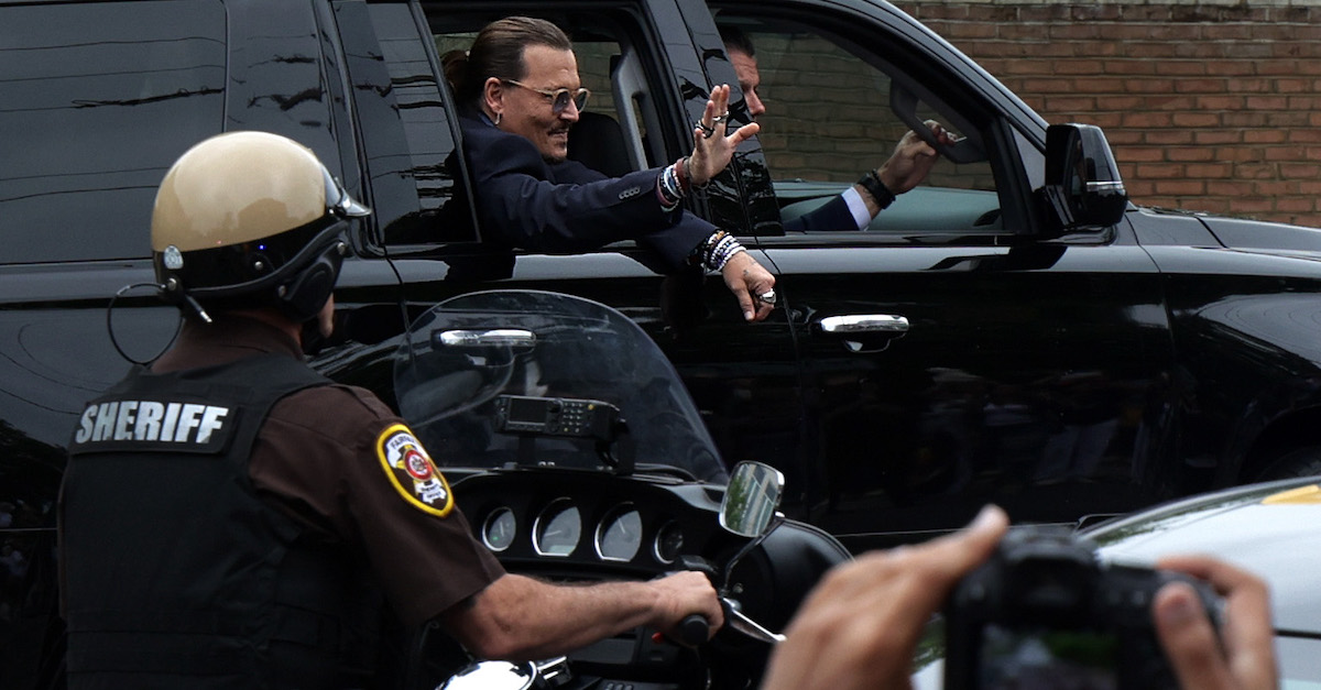 Actor Johnny Depp waves to supporters from his vehicle as he leaves a Fairfax County Courthouse May 27, 2022 in Fairfax, Virginia. Depp was not in the courtroom for the verdict, but he was said...
<br /> <a href=