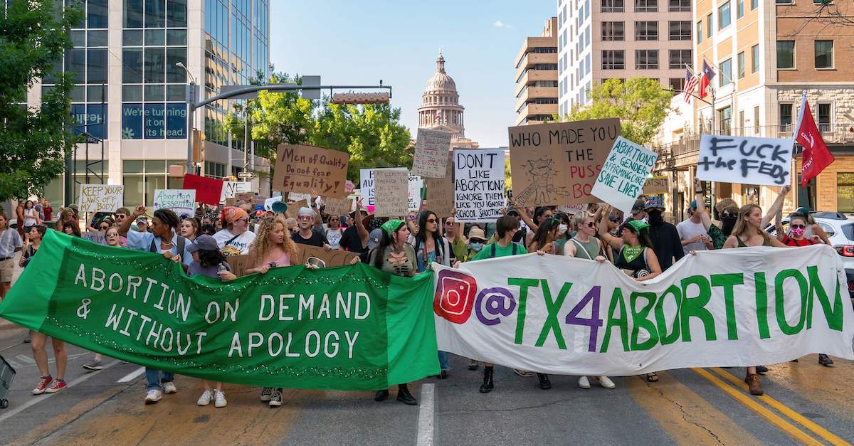 Abortion rights demonstrators gather near the State Capitol in Austin, Texas, June 25, 2022. (Photo by Suzanne Cordeiro/AFP via Getty Images.)