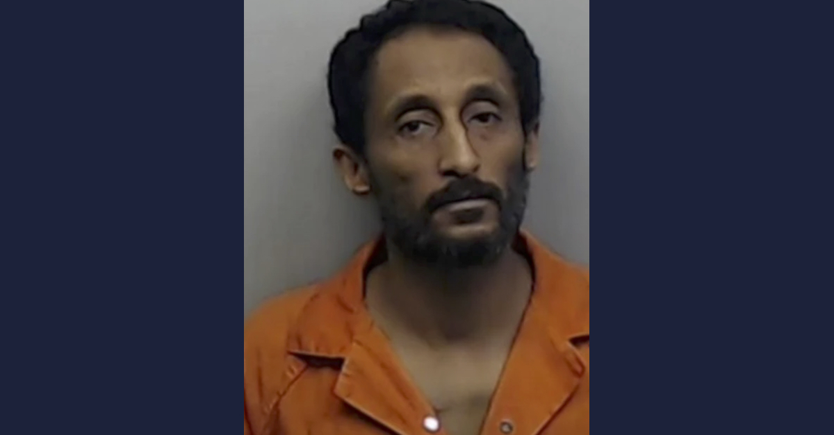 Amanuel Menghesha appears in a mugshot