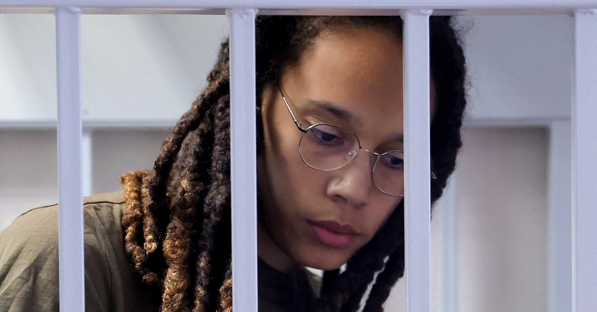 Brittney Griner in a defendant's cage during her trial.