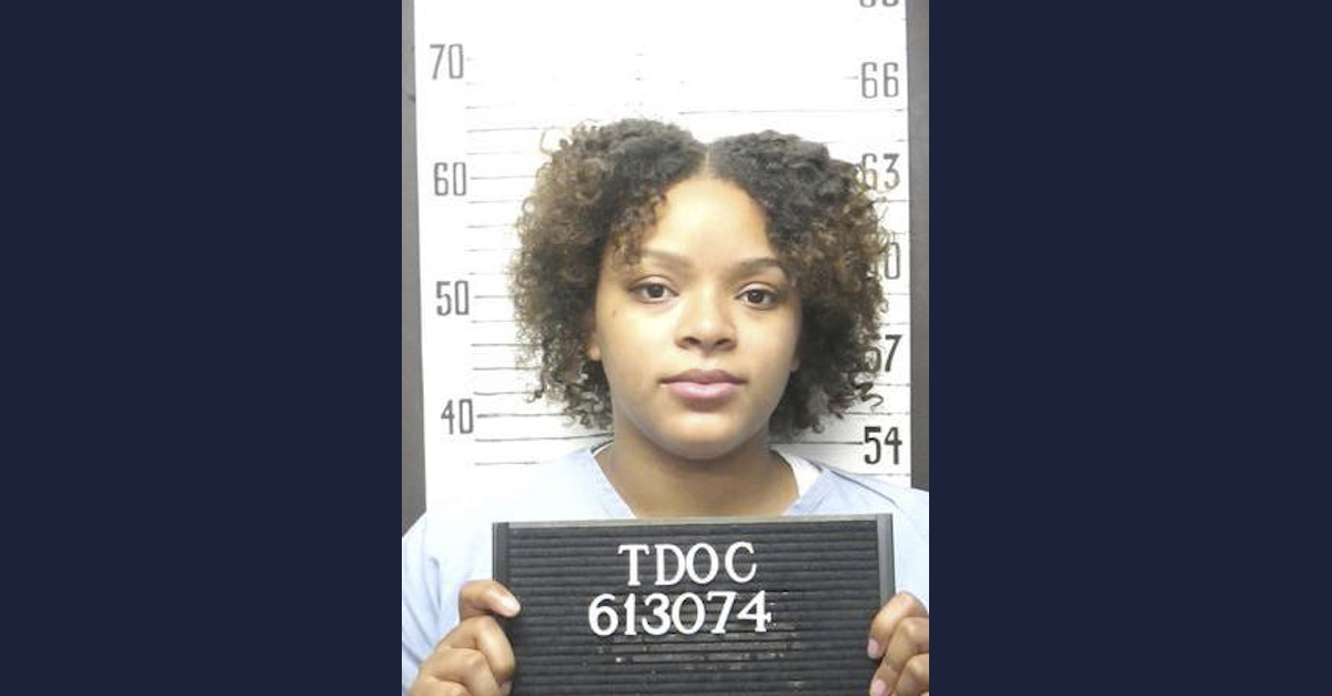 Angel Bumpass appears in a booking photo