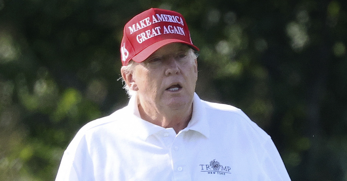 A photo shows Donald Trump golfing.