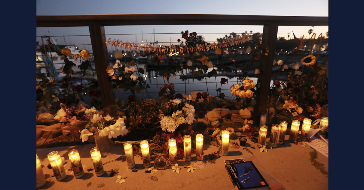 A candle vigil for victims of a fatal boat fire