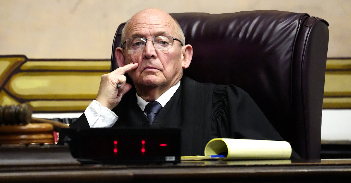 A photo shows the judge presiding over the Pike County Massacre trial. 