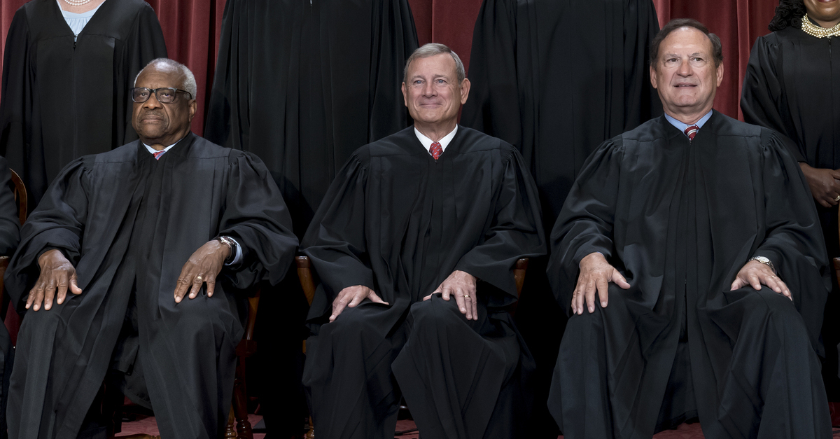  at the Supreme Court building in Washington, Friday, Oct. 7, 2022. Left to right: Associate Justice Clarence Thomas, Chief Justice of the United States John Roberts, and Associate Justice Samuel Alito. (AP Photo/J. Scott Applewhite)