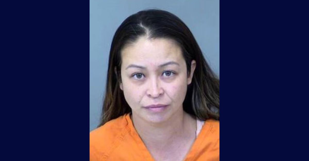 Lora Flores appears in a mugshot