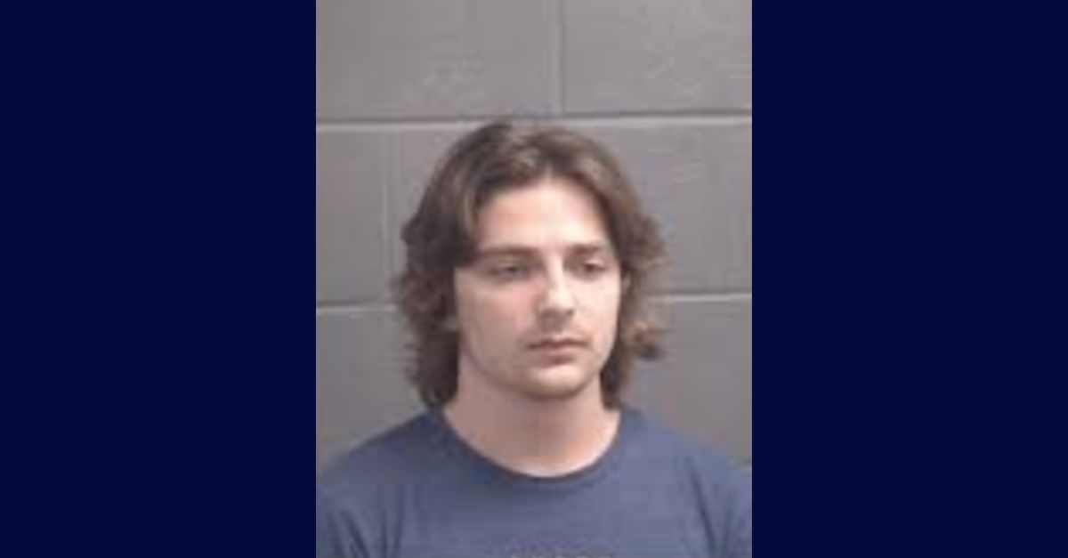 Ethan Washburn appears in a mugshot