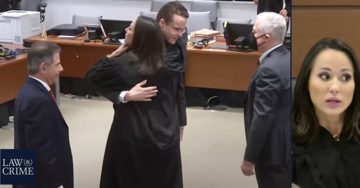 Judge Elizabeth Scherer hugs prosecutors, faces reprimand.