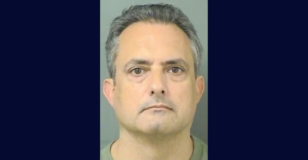 Charles Maglio appears in a booking photo