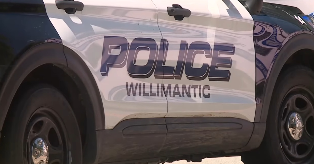 Cops in Willimantic, Connecticut, respond to an unrelated incident. (Screenshot: WTIC)