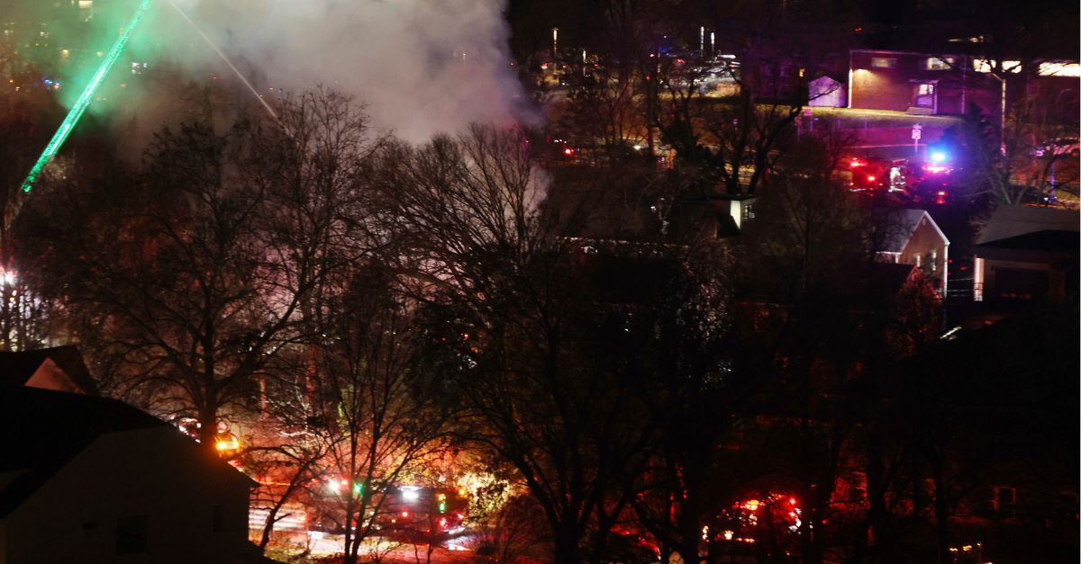 ARLINGTON, VA - DECEMBER 4: View of a fire after explosion, caused by the home owner firing a flare gun inside, as police were to search the house on December 4, 2023. Credit: mpi34/MediaPunch /IPX