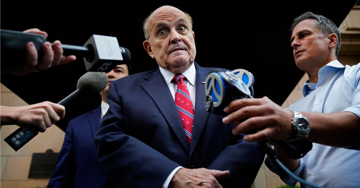 Former Mayor of New York Rudy Giuliani speaks to reporters as he leaves his apartment building in New York on Aug. 23, 2023. (AP Photo/Seth Wenig)