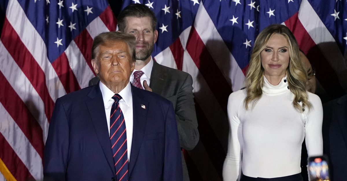 Donald Trump, on the left, his adult son, Eric Trump, in the center, and his adult daughter, Lara Trump, on the left