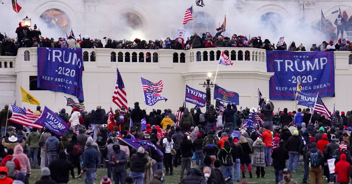 Violent rioters supporting President Donald Trump storm the Capitol in Washington, Wednesday, Jan. 6, 2021. A former Republican legislative candidate who traveled to Washington for former President Donald Trump