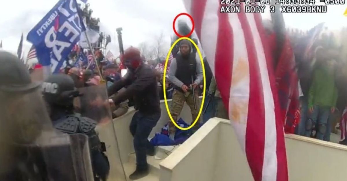 Police bodyworn camera footage shows Andrew Valentin, circled in red, and Matthew Valentin, circled in yellow, near a line of officers near the Capitol's West Plaza; Matthew Valentina holds a spray cannister in one hand and a baton in the other. Courtesy Department of Justice. 