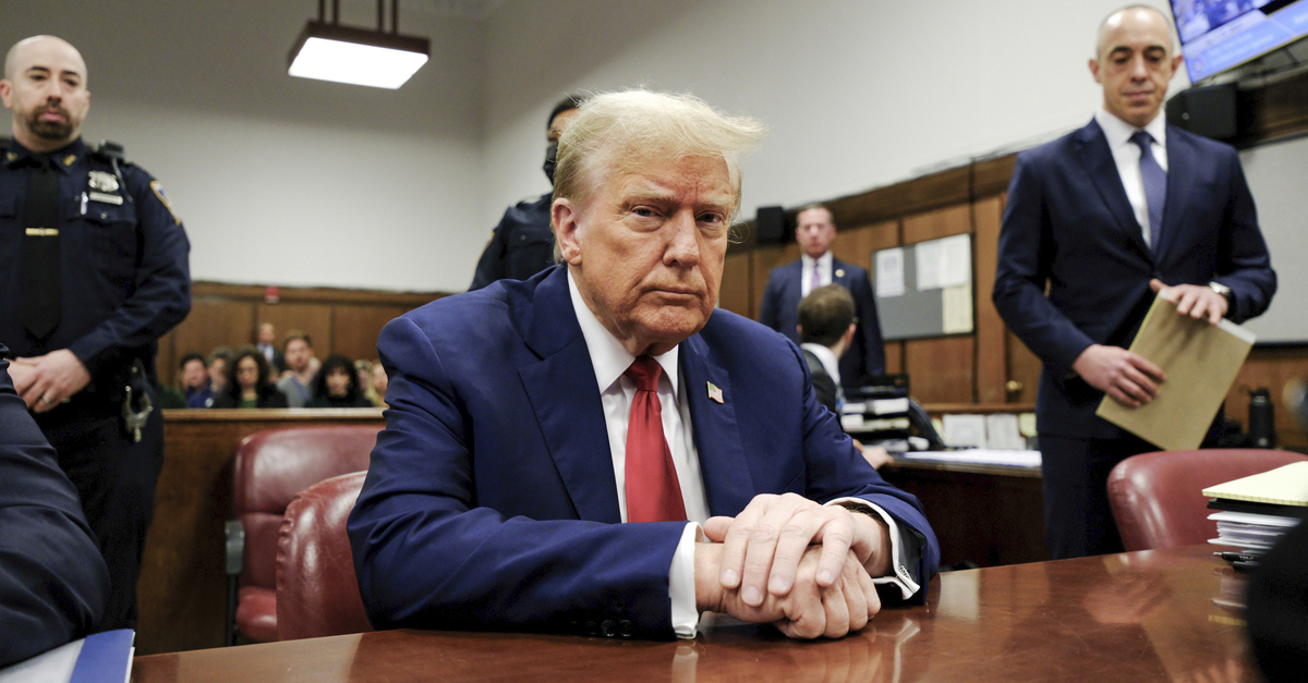 Donald Trump stares into the camera in court