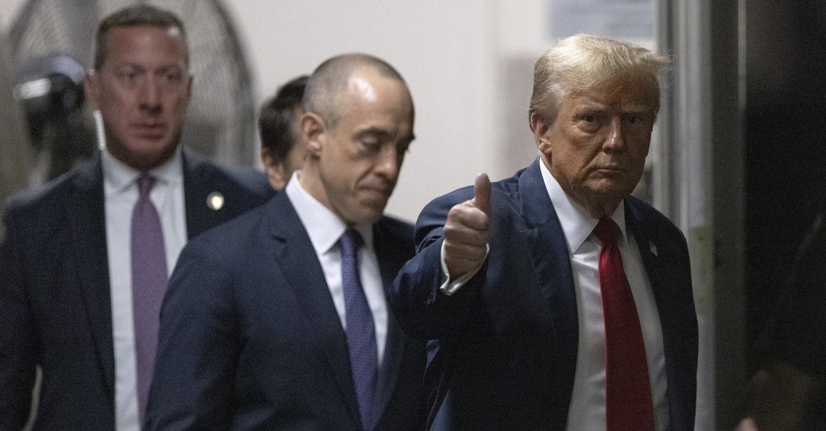 Former President Donald Trump returns from a break at Manhattan criminal court in New York.